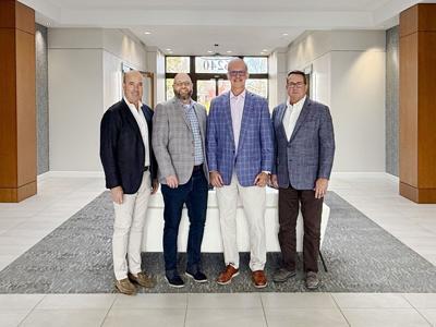 Shawmut CEO Les Hiscoe; First Finish partner and executive vice president Bryan Higgins; First Finish president & founder David Burman; Shawmut executive vice president Randy Shelly.