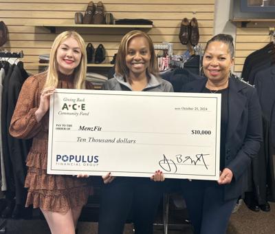 Populus Financial Group presents a $10,000 donation to Rhonda Willingham, Founder and President of MenzFit