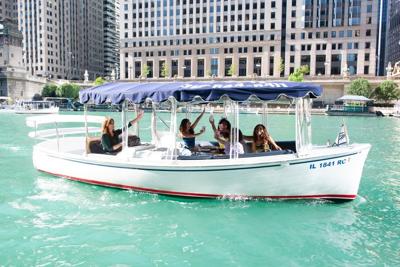 The Italian American Human Relations Foundation (IAHRF) has partnered with Chicago Boat Company to offer rental boats, complete with licensed operators, so anyone can join the illuminated parade through the heart of downtown. (Photo | Chicago Boat Company)