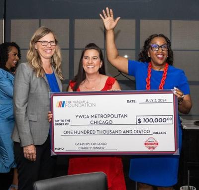 NASCAR Chicago Street Race President Julie Giese, left; NASCAR Foundation Executive Director Nichole Krieger; and YWCA Metropolitan Chicago CEO Nicole Robinson receive check from the NASCAR Foundation at "Gear Up For Good" dinner at RPM Steak July, 2024...