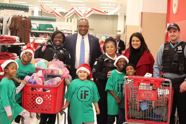 Richard Boykin with 23rd Ward Alderwoman Silvana Tabares at Israel Idonije's "Shop with a Cop" event.