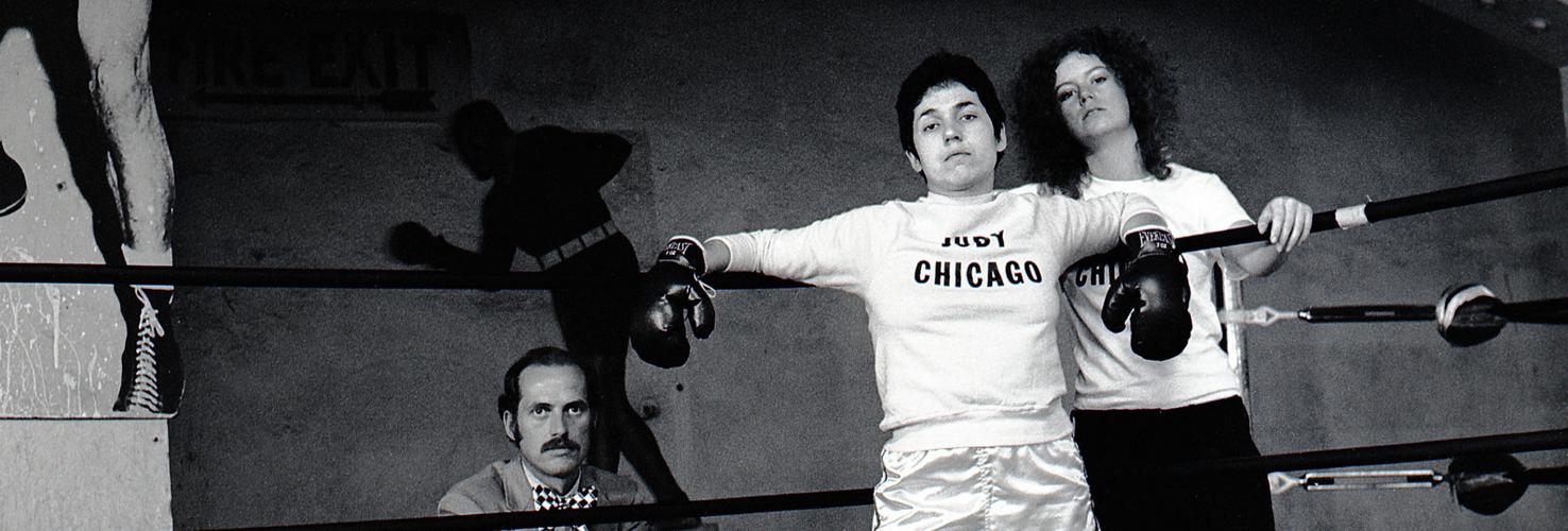 Jerry McMillan, Judy Chicago as a Boxer, to announce her name change and show at CalState Fullerton, 1970. Courtesy of Jerry McMillan and Craig Krull Gallery, Santa Monica.
