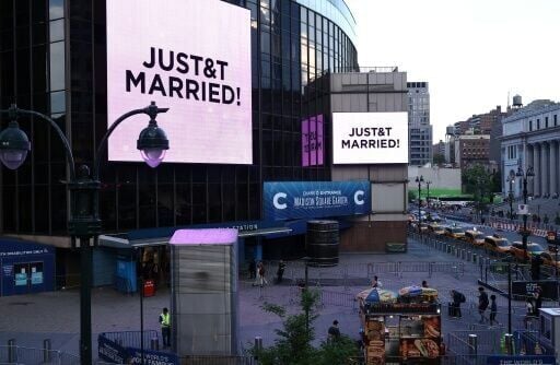 Giant screens showing the message "JUST&T MARRIED!" (T&T for Taylor Swift and Travis Kelce) are seen outside Madison Square Garden