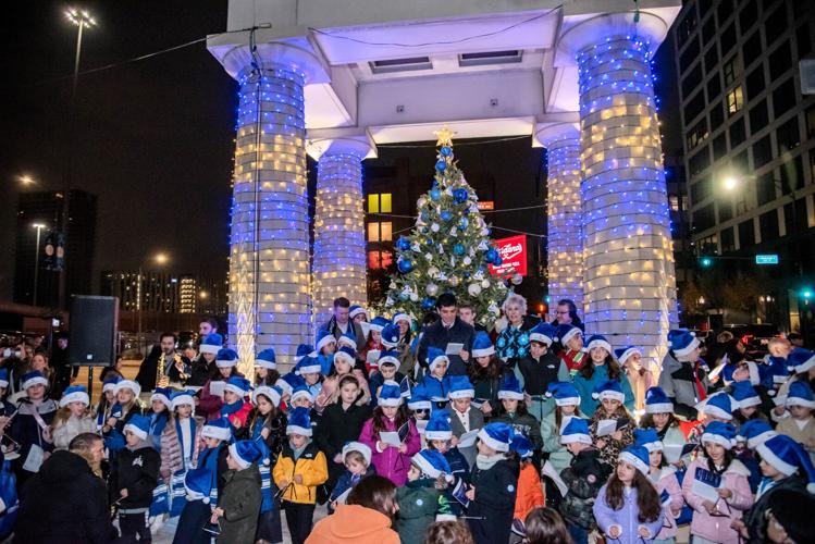 The season in Greektown Chicago officially began Sunday, Nov. 23, when the community gathered at Elysian Field (at Halsted & Van Buren) for Greektown’s 10th annual Christmas tree lighting and caroling. (Elios Photography)