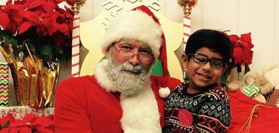 New Eastside resident Vikram Konkimalla visits with Santa at Watertower Place. Photo submitted by Reemaa Konkimalla.