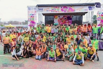 Participants and volunteers drenched in color at Sewa's Holi event in Atlanta, GA.