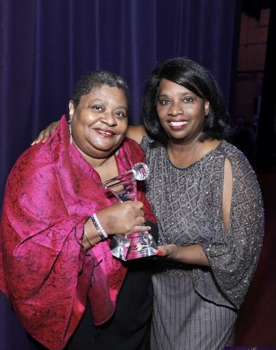 Deitra Farr receives the Excellence in Music/Blues Award from Mable Buckner, event founder. (Photo by Mila Samokhina)