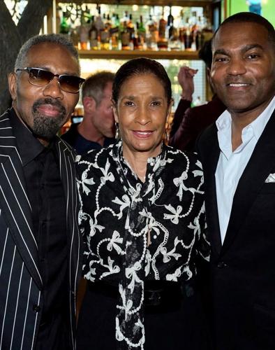 Marc Brooks (R) and party guests. (Parrish Lewis Photography)