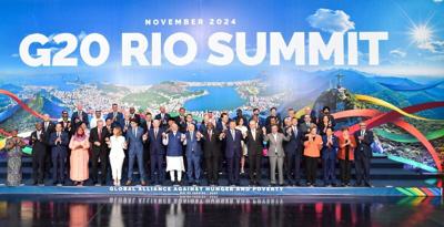 President Xi Jinping and other G20 leaders take a group photo after the conclusion of the 19th G20 Summit in Rio de Janeiro, Brazil, on Tuesday.& LI TAO/XINHUA