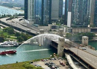 Chicago’s DuSable Lake Shore Drive bridge became stuck open Wednesday after a scheduled lift, with fire boats spraying water to cool the bridge as crews worked to restore traffic. (Sheree Schimmer photo)