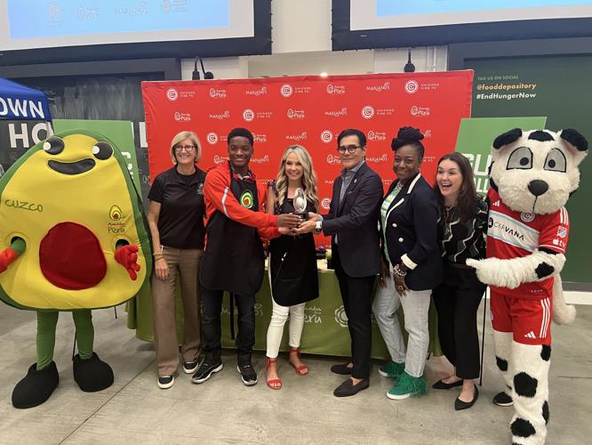 Greater Chicago Food Depository "Guacamole Challenge" to raise awareness for healthy eating. Winner Natalie Bomke holds the Silver Avocado Award.  (Photo by Candace Jordan)