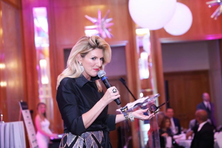 Alyssa Quinlan, CEO Hindman Auctions, graciously donated her time to lead the paddle raise for the event. (Photo by Mila Samokhina)