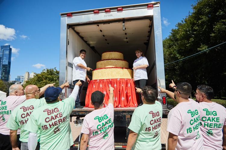 Eli's Cheesecake team welcoming the "Big Cake." (Tim Musho photo)
