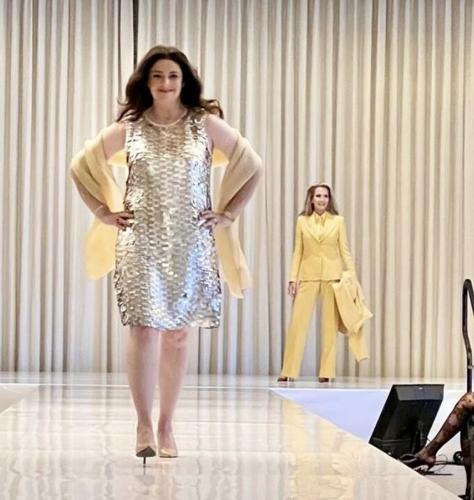Paula Borg struts the runway, with Shauna Montgomery (in yellow) behind.