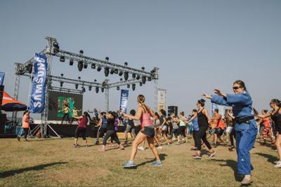 Dumbbells, DJs & downward dogs: Chicago’s Faces of Fitness Festival has it all