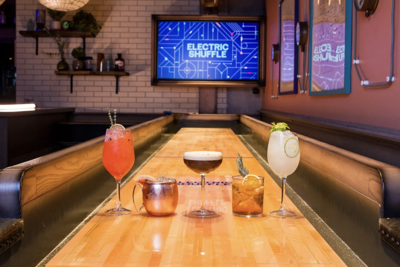 Slide into the action at River North’s state-of-the-art shuffleboard bar Electric Shuffle