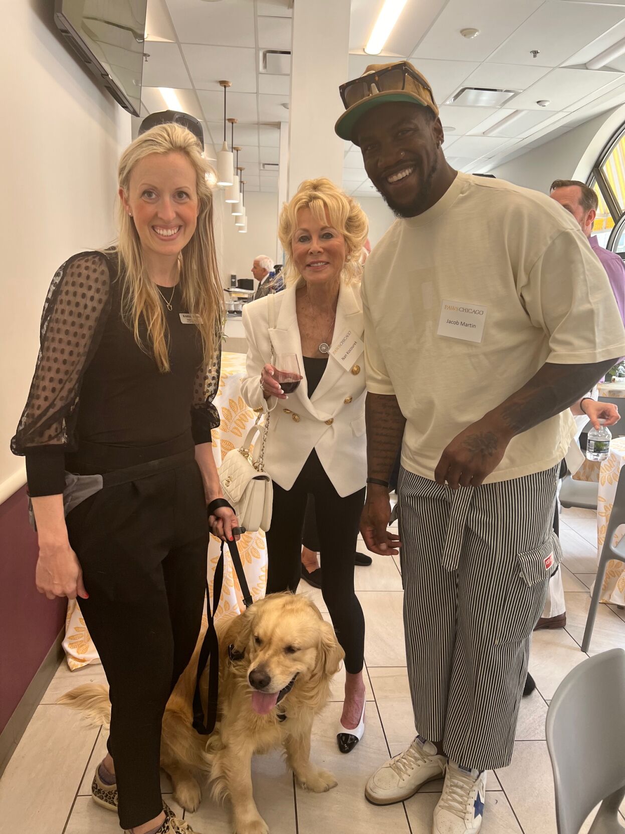 Nan Kocourek with PAWS Chicago's Kristina Rosinia and Jacob Martin, a new Chicago Bear player. He reached out to PAWS asking if he could be a foster. (Photo Candace Jordan)