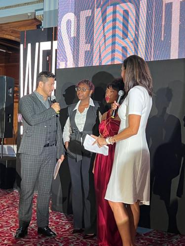 Designer Senbi Turner is interviewed after her collection debut. (Candace Jordan photo)