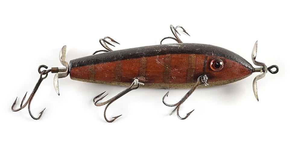 The historic first American wooden minnow characterizing the link between the rotary and cedar plugs of the late 1890s and the first commercially offered minnows from just after the turn of the century. Estimate: $15,000-$30,000