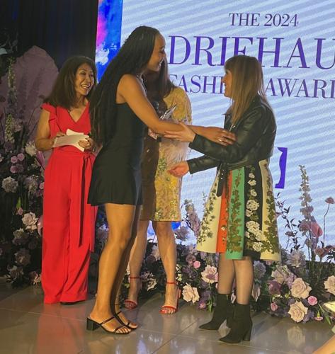 2nd place winner and Neiman Marcus award recipient Brianna Yanga, accepts congratulations from Wendy Krimins of Neiman Marcus Michigan Ave. (Photo Candace Jordan)