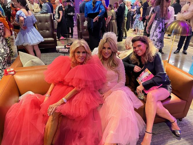 Feathers and fashion, Sherry Lea Fox (in red) and friends. (Photo by Candid Candace Jordan)