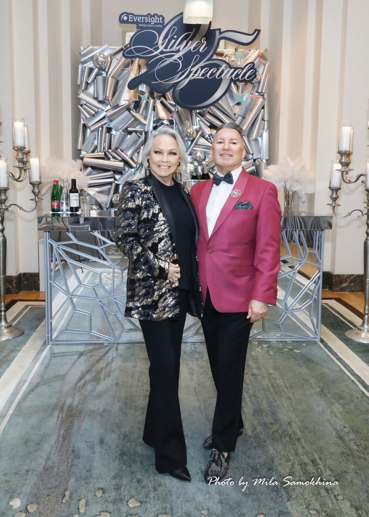 Event co-chairs for the 6th year, Candace Jordan and Michael Caputo, standing in front of the dramatic decor by Kehoe Designs. (Photo by Mila Samokhina)