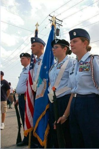 Brendan Beyer, Austin Ramey, Erin Pulcher and Jodie McKnight pay homage to our fallen heroes on a Memorial Day in Dupo, Illinois.