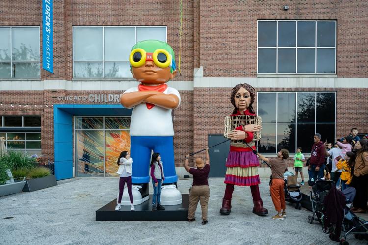 Amal met a kid that is even taller than she is when she visited “Flyboy” by Chicago artist Hebru Brantley outside of the Chicago Children’s Museum. (Photo by Ty.Optix Photography)