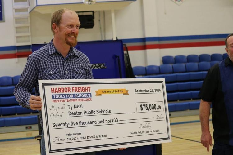 Ty with Check.JPG