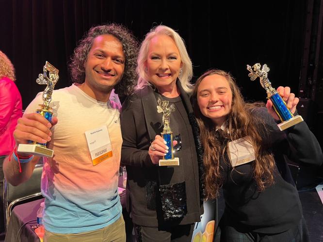 Tutoring Chicago's "Celebrity Spelling Bee" winners: Rushil Kassety, Candace Jordan and Deanna Belos. (Photo by John Robak)