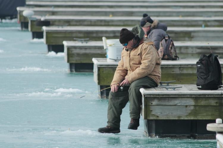 Ice fishing in Chicago's DuSable Harbor with local enthusiast Chris Ranney