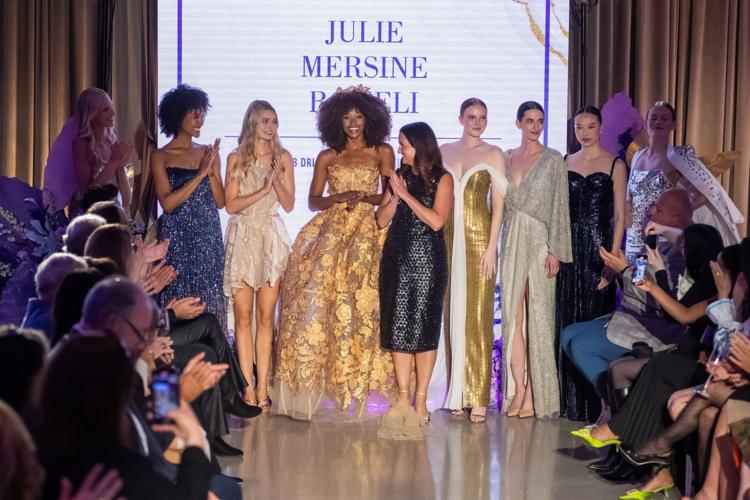 Julie Mersine Romeli, owner Mira Couture, and Driehaus Fashion Awards alum, pictured center in black with her designs. (Allen Bourgeois photo)
