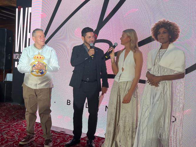Bela Lobo designers are interviewed after the Chicago debut of their collection at World Fashion Fest. Cesar Rolon, event founder, on left. (Candace Jordan photo)
