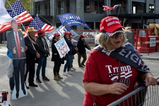 Supporters wait for Donald Trump at a campaign rally in Green Bay, Wisconsin