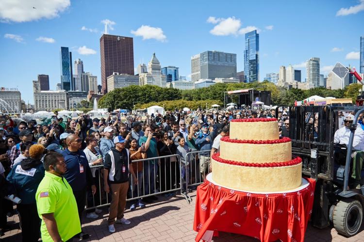 A huge crowd queued up for a slice of Eli's. (Tim Musho photo)