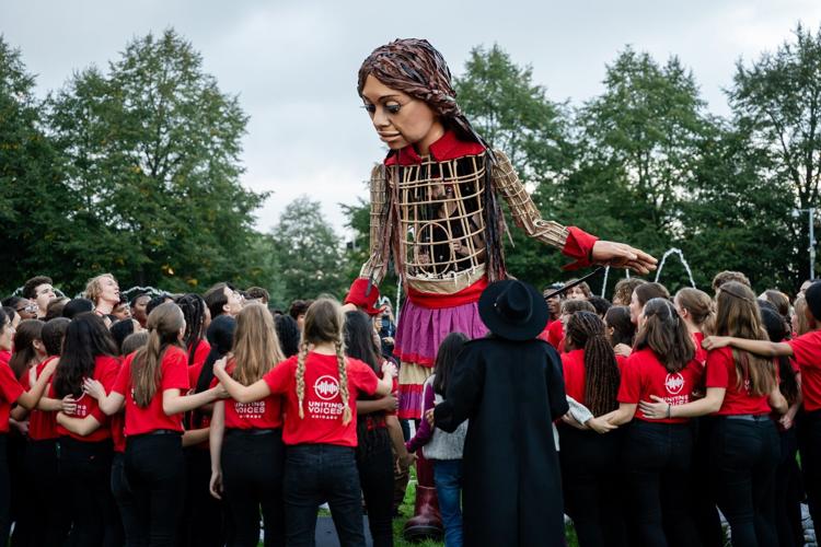 To welcome Amal, 90 members from Uniting Voices’ choral programs performed their original song “We All Live Here” in Polk Bros Park. (Photo by Ty.Optix Photography)