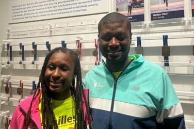 Jasmine Murrell (L) and husband Kevin Orcel, visually impaired runners from New Jersey who will run the New York City Marathon on November 3, pose in New York on October 8, 2024