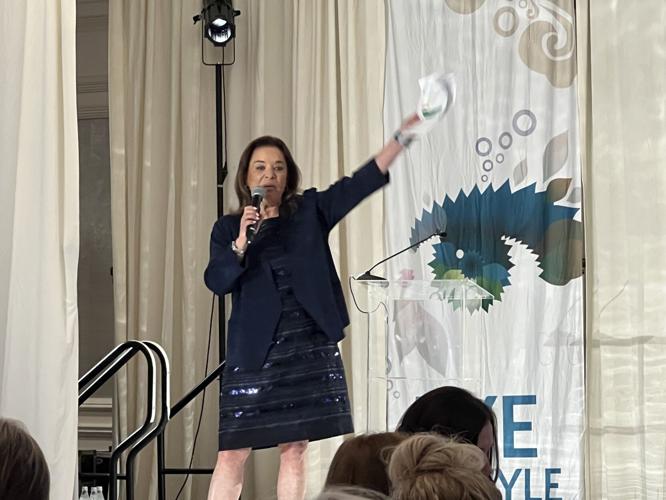 Roberta Kramer, VP of Heritage Auctions, donated her time and talent to conduct the paddle raise. (Candace Jordan photo)