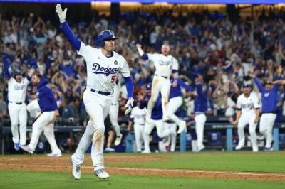 Freddie Freeman rounds the bases triumphantly after his walk-off grand slam for the Los Angeles Dodgers in game one of the World Series on Friday