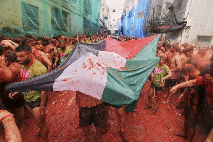 Tons of overripe tomatoes become projectiles in Spain #39 s Tomatina food