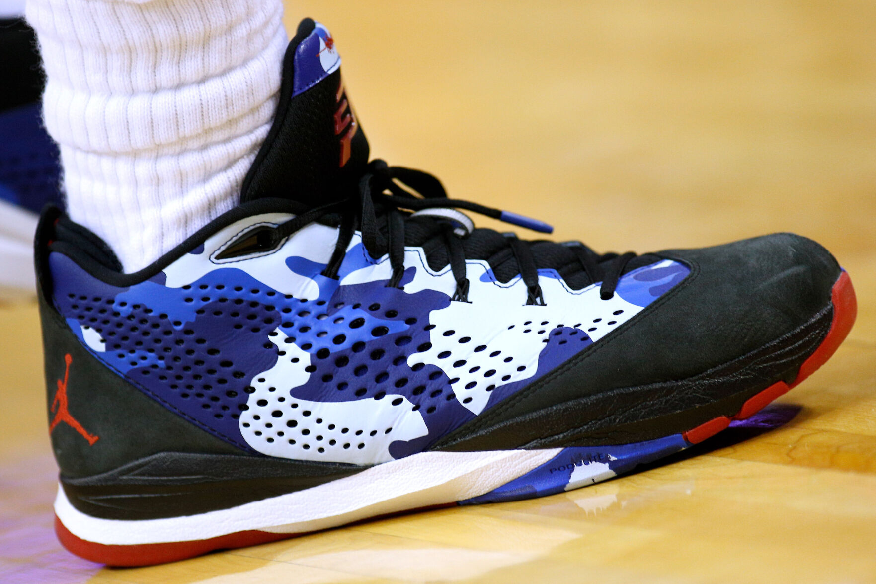 half black half red jordans