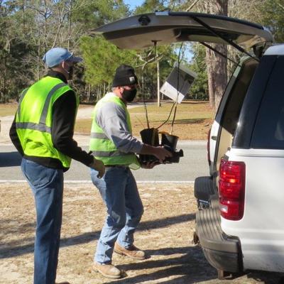 Drive-through tree giveaway a local Arbor Day tradition