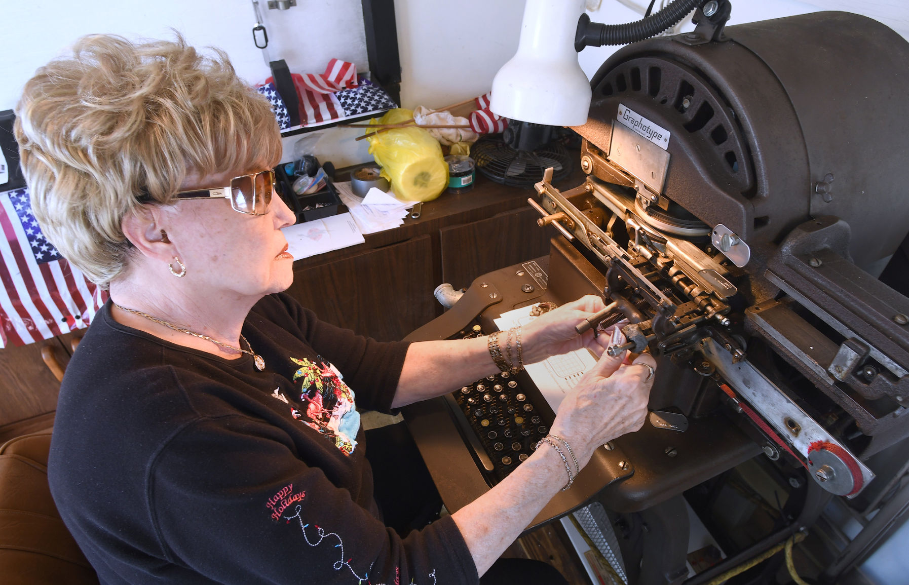 Local couple use vintage dog tag machine to craft tags for