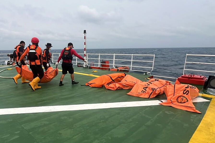 Divers recover a total of 52 bodies from capsized ferry in Indonesia after a dayslong search | Nation / World AP news of the day | chronicleonline.com