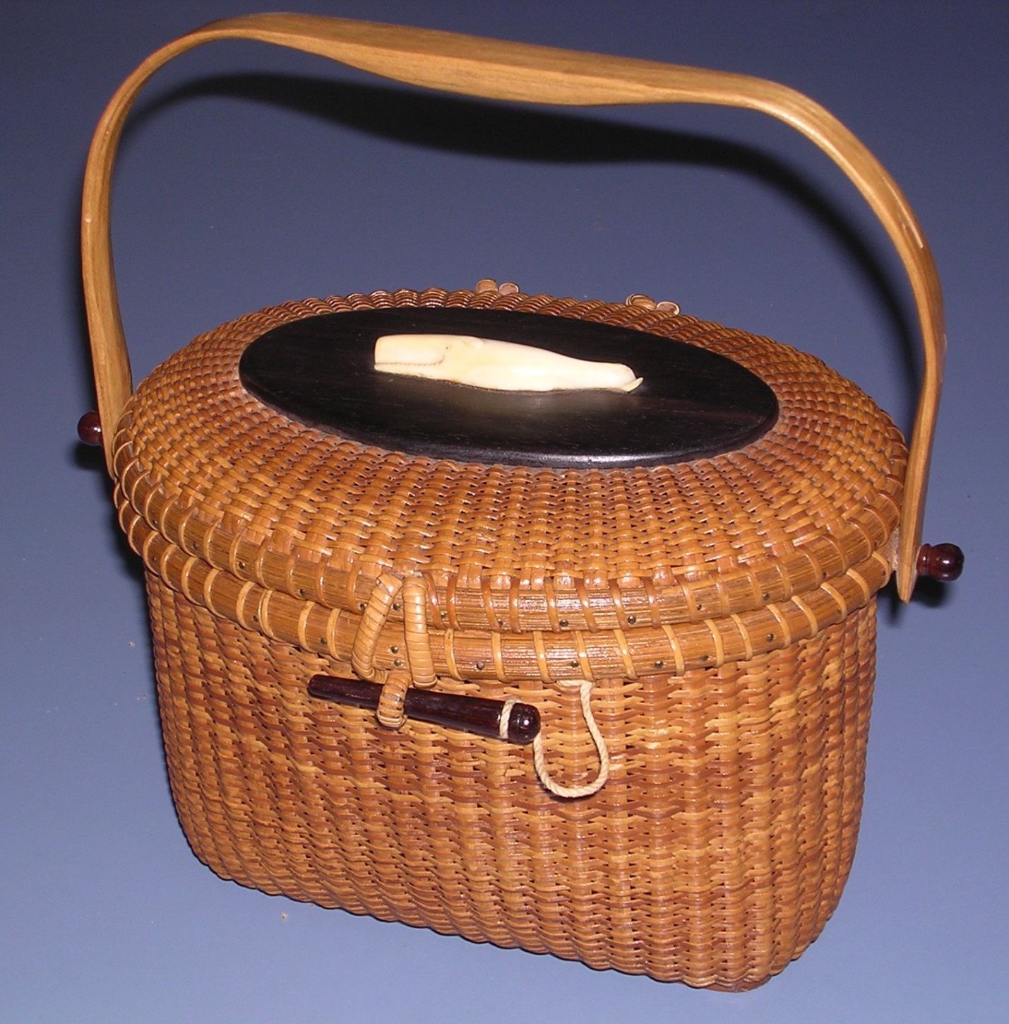 Lot - Nantucket basket purse with scrimshaw ivory/bone sailboat attached to  lid, and other ivory/bone embellishments, interior signed 