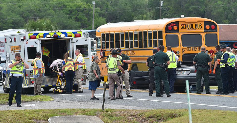 Two injured after car collides with back of school bus | Local News ...