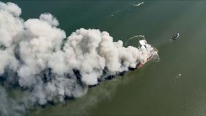 Massive fire breaks out aboard scrap metal barge on Delaware Bay