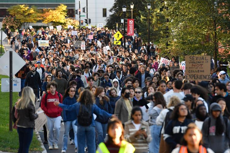 A crowd of students protests Cornell's response to gang rape complaint ...