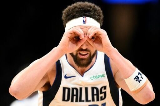 Klay Thompson of the Dallas Mavericks reacts after a three-point basket in an NBA victory over the Boston Celtics