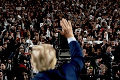 Former President Donald Trump waves to the crowd when he attended the Clemson vs. South Carolina football game at  Williams-Brice Stadium on November 25, 2023. At an April 6, 2024 fundraising event in Florida, the Trump 2024 campaign reported record-set...